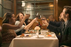 Couples toasting wine at restaurant